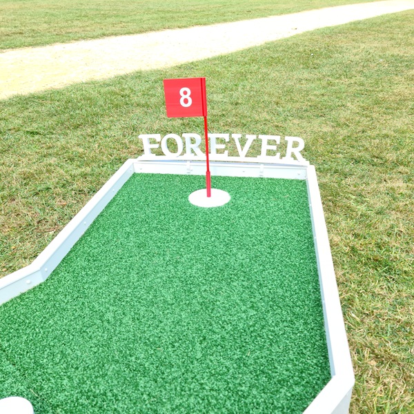 Forever sign clipped onto mini golf course all 3d printed in white.