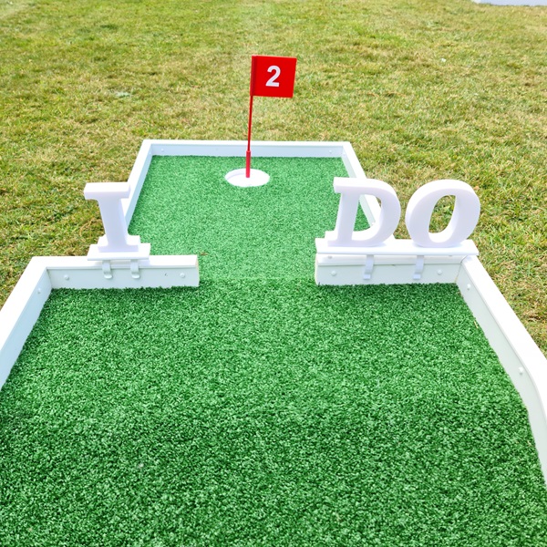 I Do signs on mini golf course setup for a wedding day hire available on our wedding package