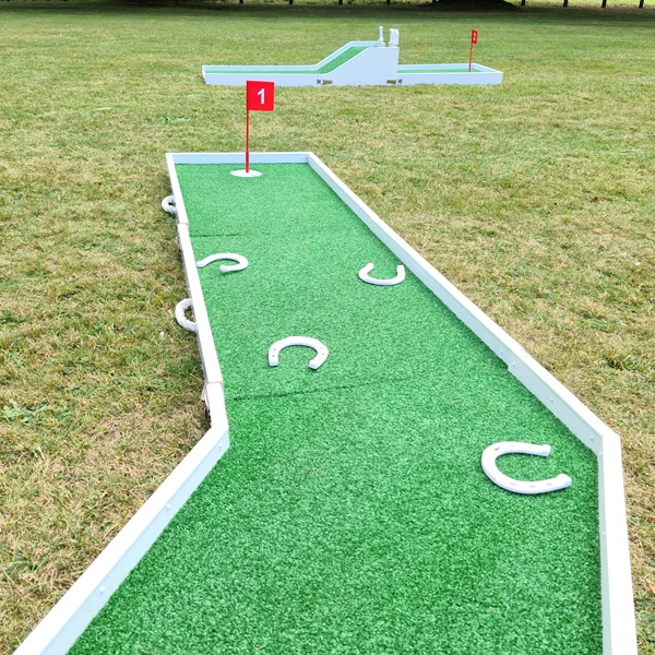 3d printed lucky horseshoes laid out on mobile crazy golf course as an add on package for crazy golf hire.