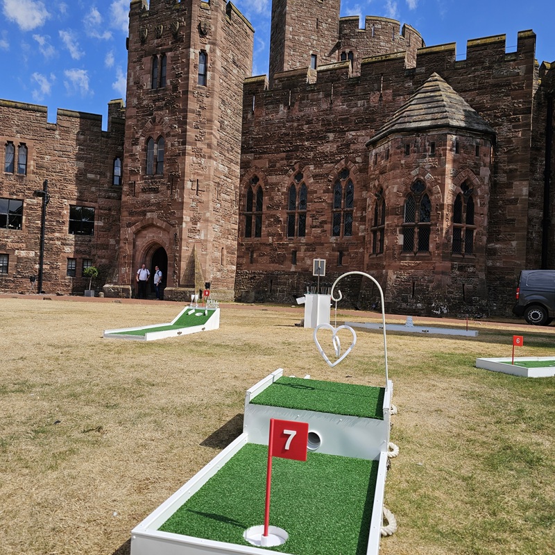 Mini Golf Cheshire at Peckforton Castle with Wedding Guests Playing mini golf